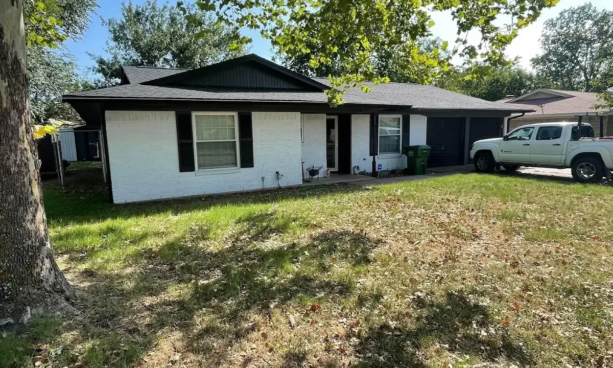 Professional roofing crew working on a residential roof in Wakefield